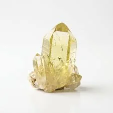A small natural crystal cluster in translucent golden yellow tones