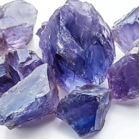 A close view of rough translucent crystals in violet and pale lavender tones